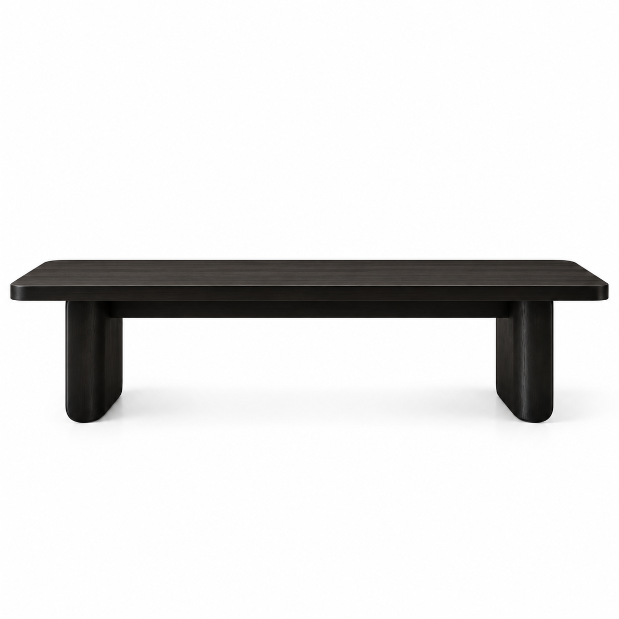 Vista en perspectiva del Comedor Eclipse en un comedor amplio. Mesa de líneas orgánicas con cubierta de encino entintado y base escultural de herrería oscura por BRARIO.